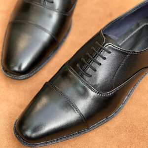 Jet black full grain cow leather cap-toe Oxford shoes